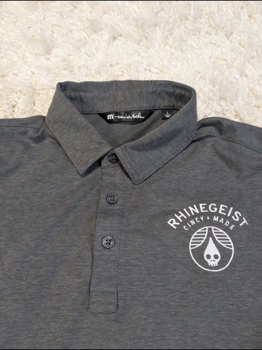 TravisMathew Charcoal Gray Polo with Rhinegeist Chest Logo